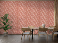 Minimalist dining room showing terracotta floral wallpaper behind a wooden table.
