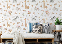 Animal pattern wallpaper behind a daybed with blue and white pillows.