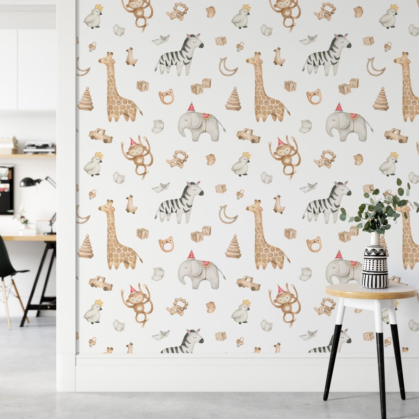 Watercolor safari animal wallpaper on a partition wall in a workspace.