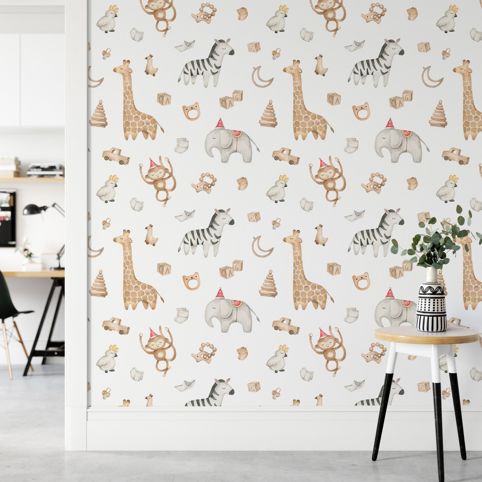 Watercolor safari animal wallpaper on a partition wall in a workspace.