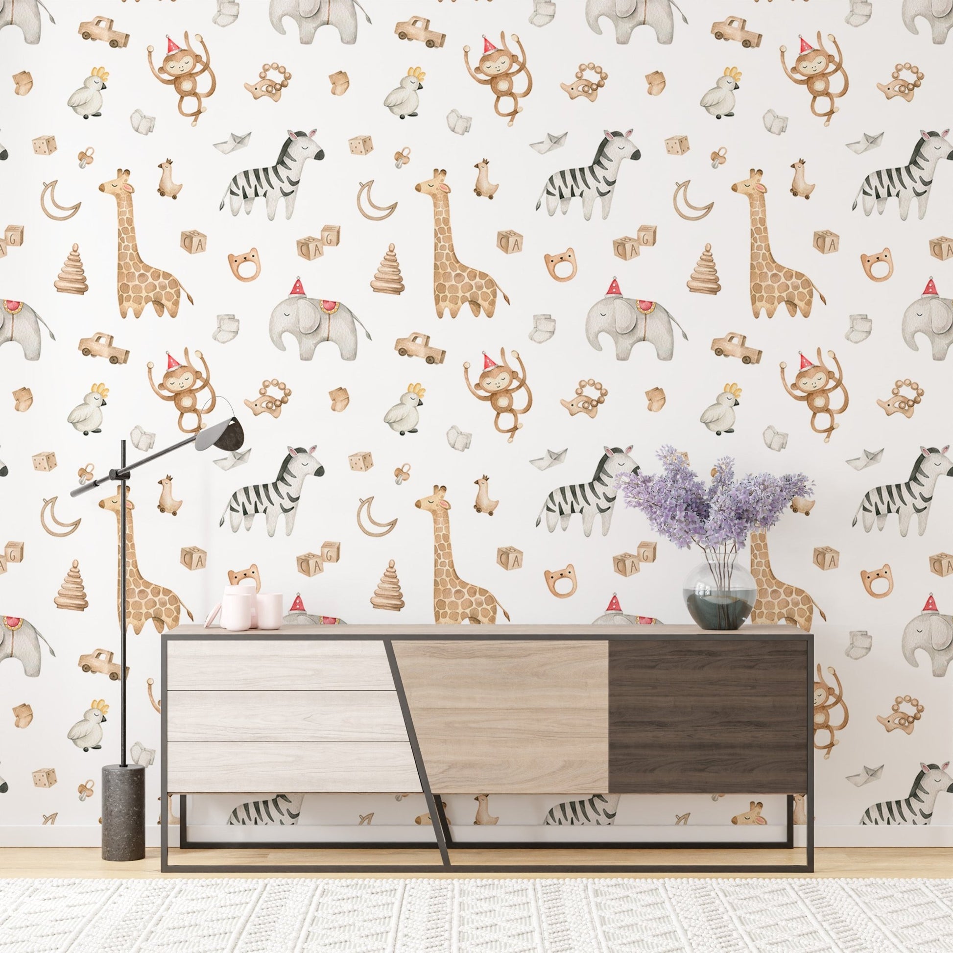 Kids wallpaper with monkeys and zebras behind a mid-century sideboard.