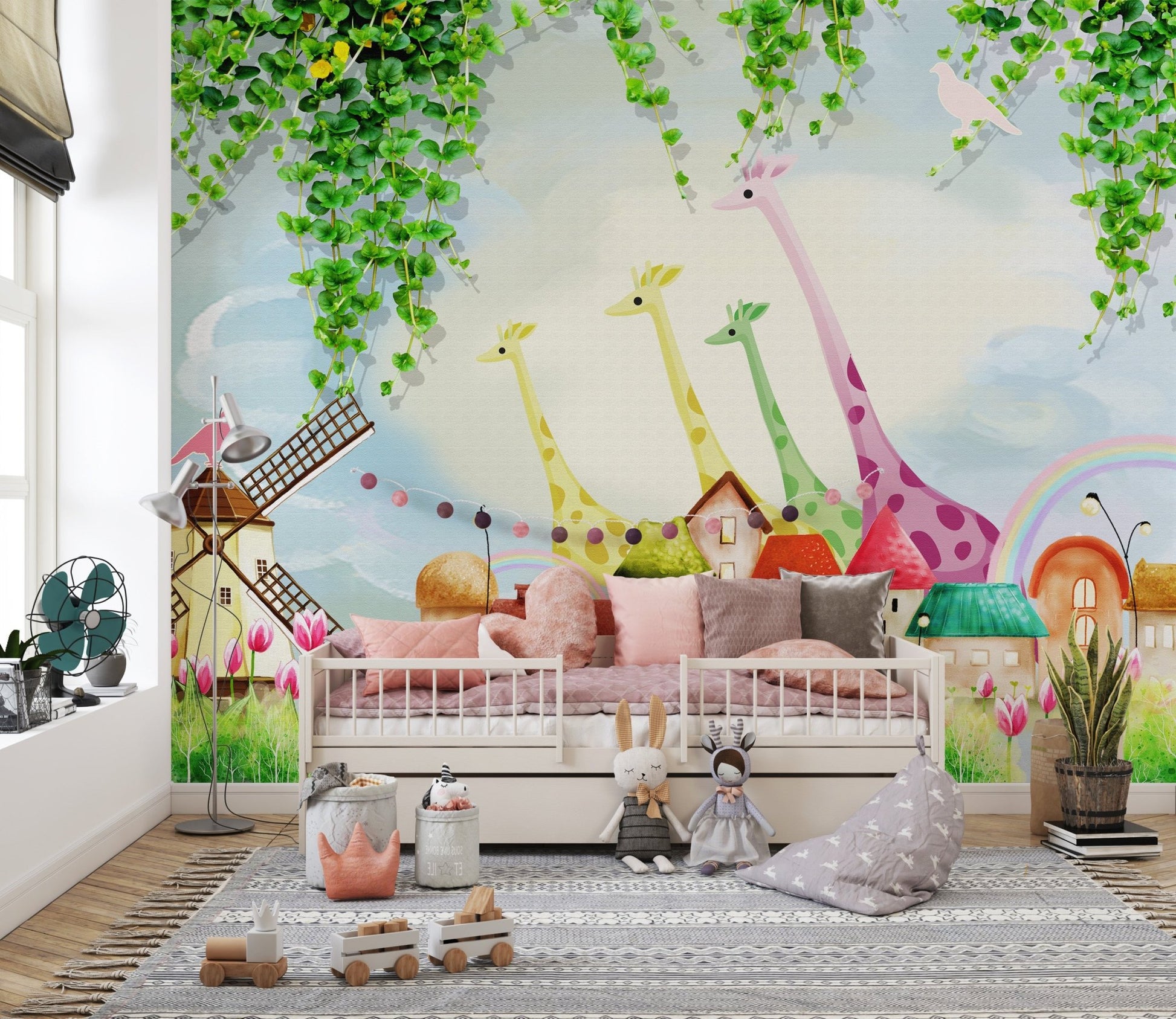 Cartoon funland wall mural featuring a windmill and rainbow in a children's bedroom.