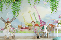 Giraffe themed watercolor wall mural with green hanging vines and pink tulips in a nursery.