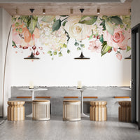 Elegant watercolor tapestry mural with soft floral patterns in cafe area.
