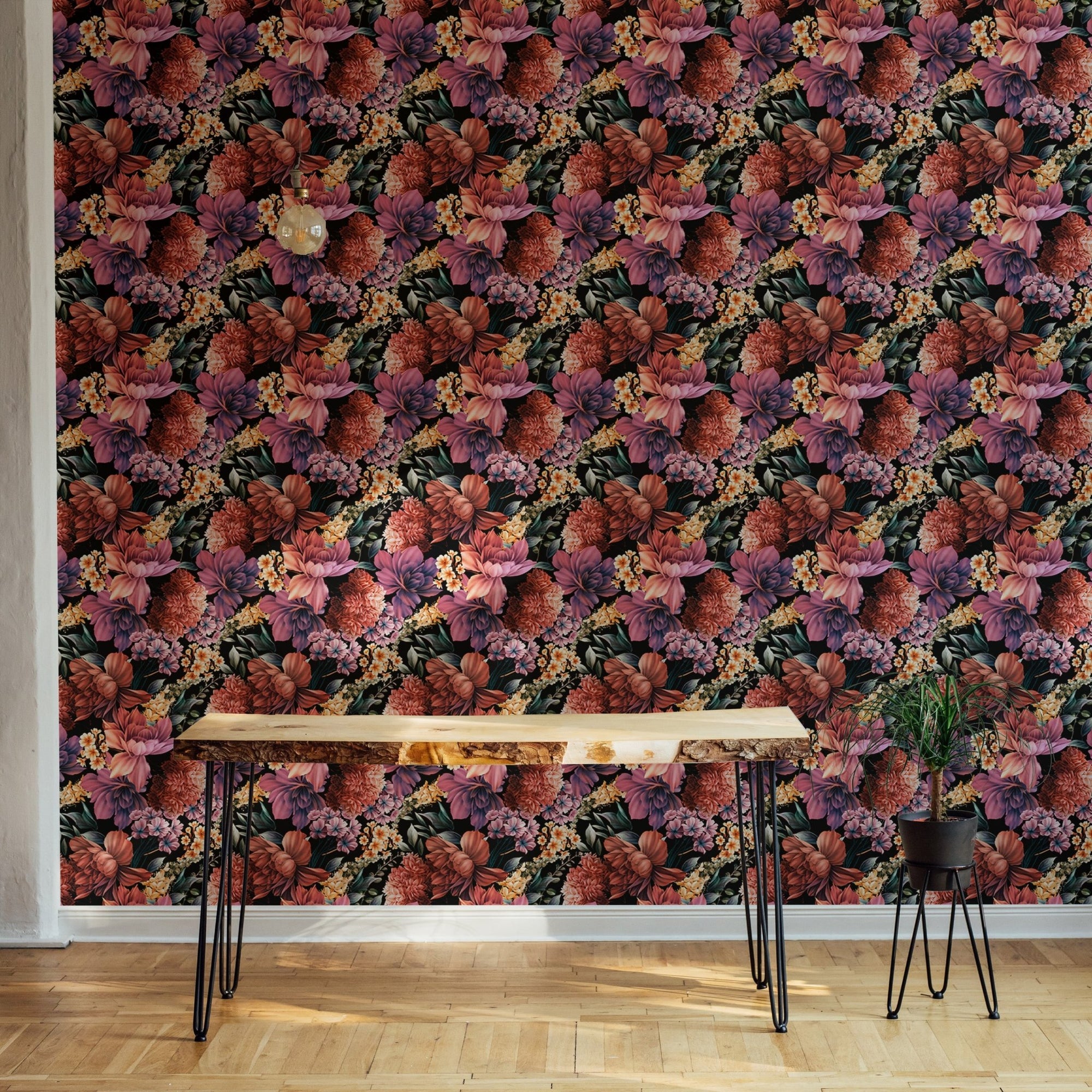 Purple and orange flower wallpaper on a living room wall behind a wooden table.