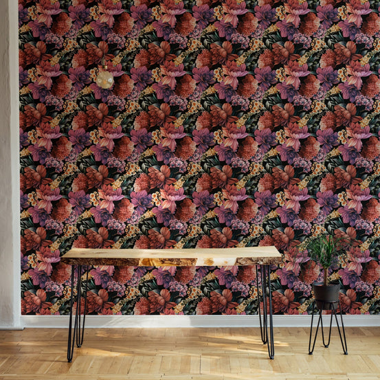 Purple and orange flower wallpaper on a living room wall behind a wooden table.