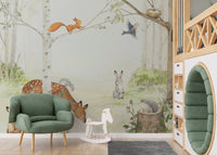 Whimsical kids wall mural with forest animals in nursery.