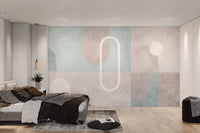 Abstract geometric mural featuring arches, circles and blocks in bedroom.