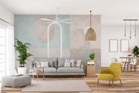 Soft geometric wall mural with watercolor-inspired shapes in living room.