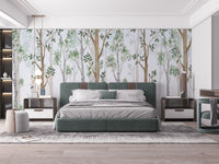 Large green upholstered bed positioned in front of a forest landscape wall mural.