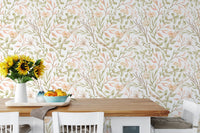 Meadow flower wallpaper in a dining area with sunflowers and white chairs.