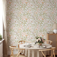 Floral meadow wallpaper behind a round dining table and wooden chairs.