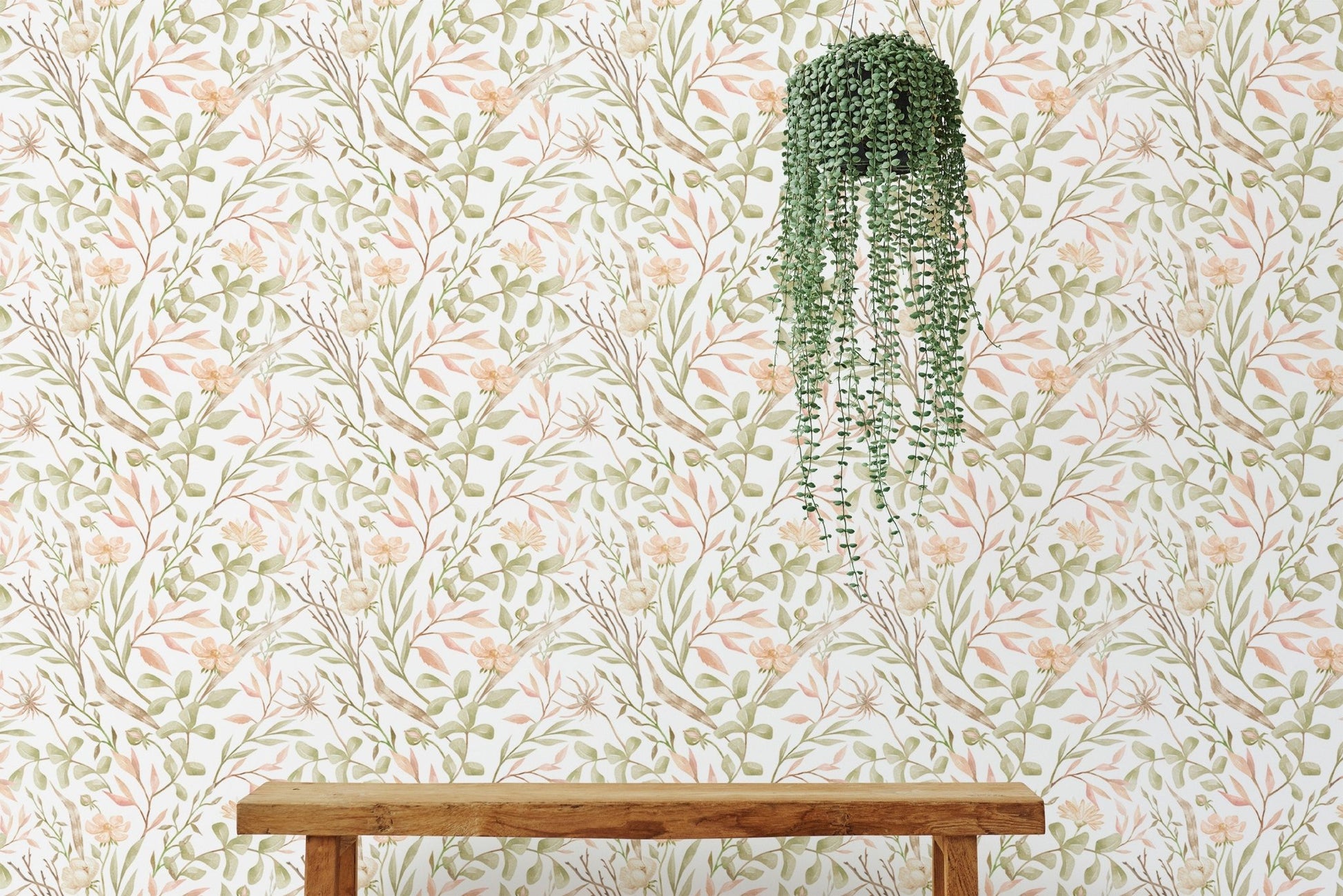 Watercolor green leaf and branches meadow flower wallpaper on a feature wall.