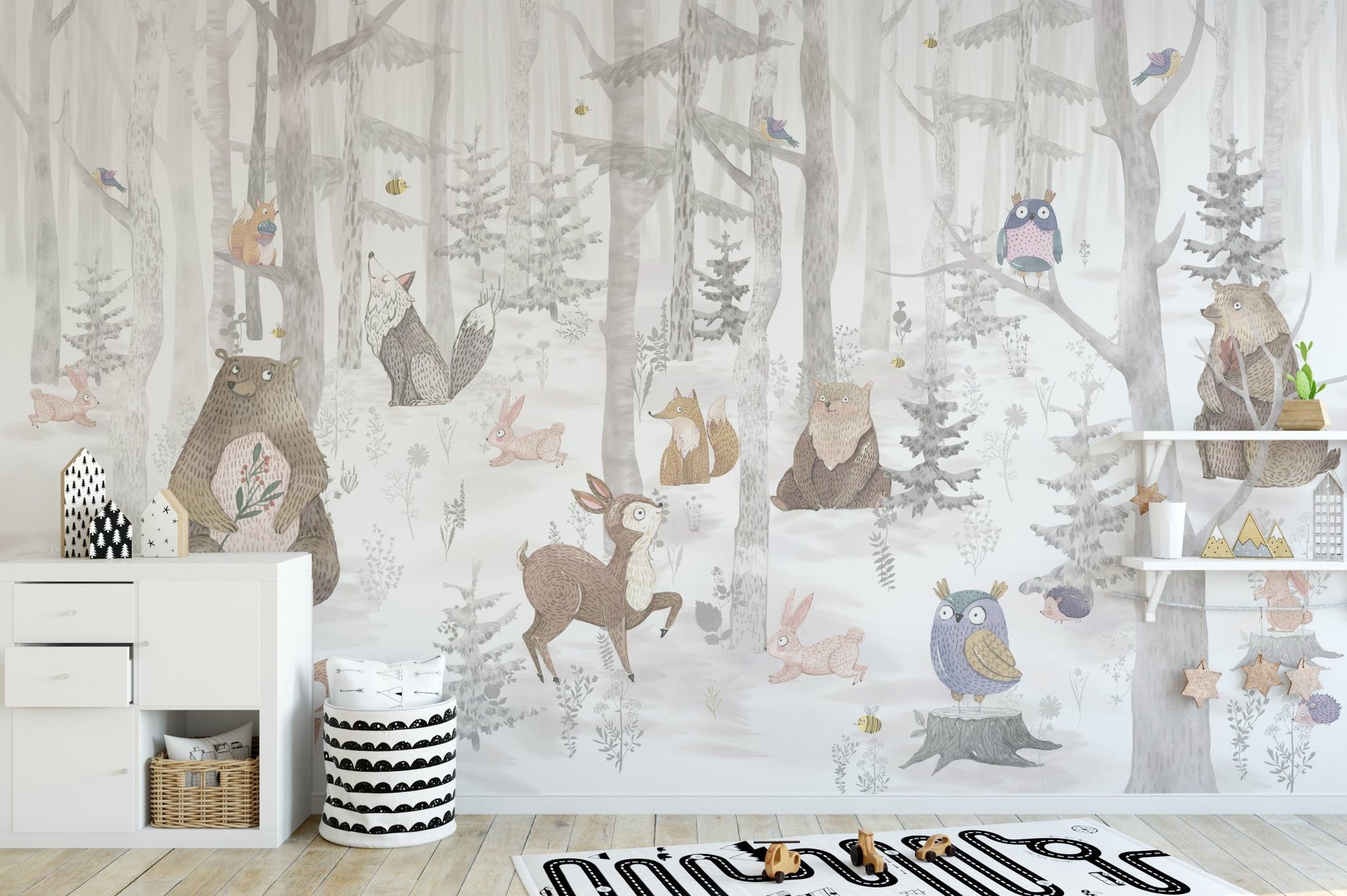 Bright watercolor animal wall mural in kids play room.