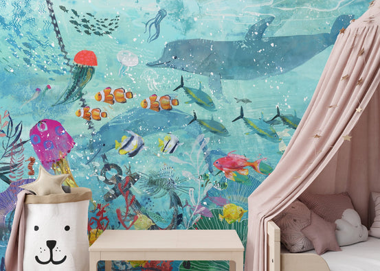 Watercolor marine life wall mural in a kids bedroom with pink canopy.
