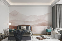 Pink and grey watercolor mountain wall mural in a bedroom