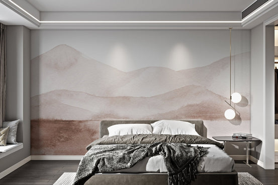 Grey and blush watercolor mountain wall mural in a bedroom.