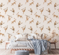 Watercolor monkeys on branches wallpaper in a modern bedroom setting.