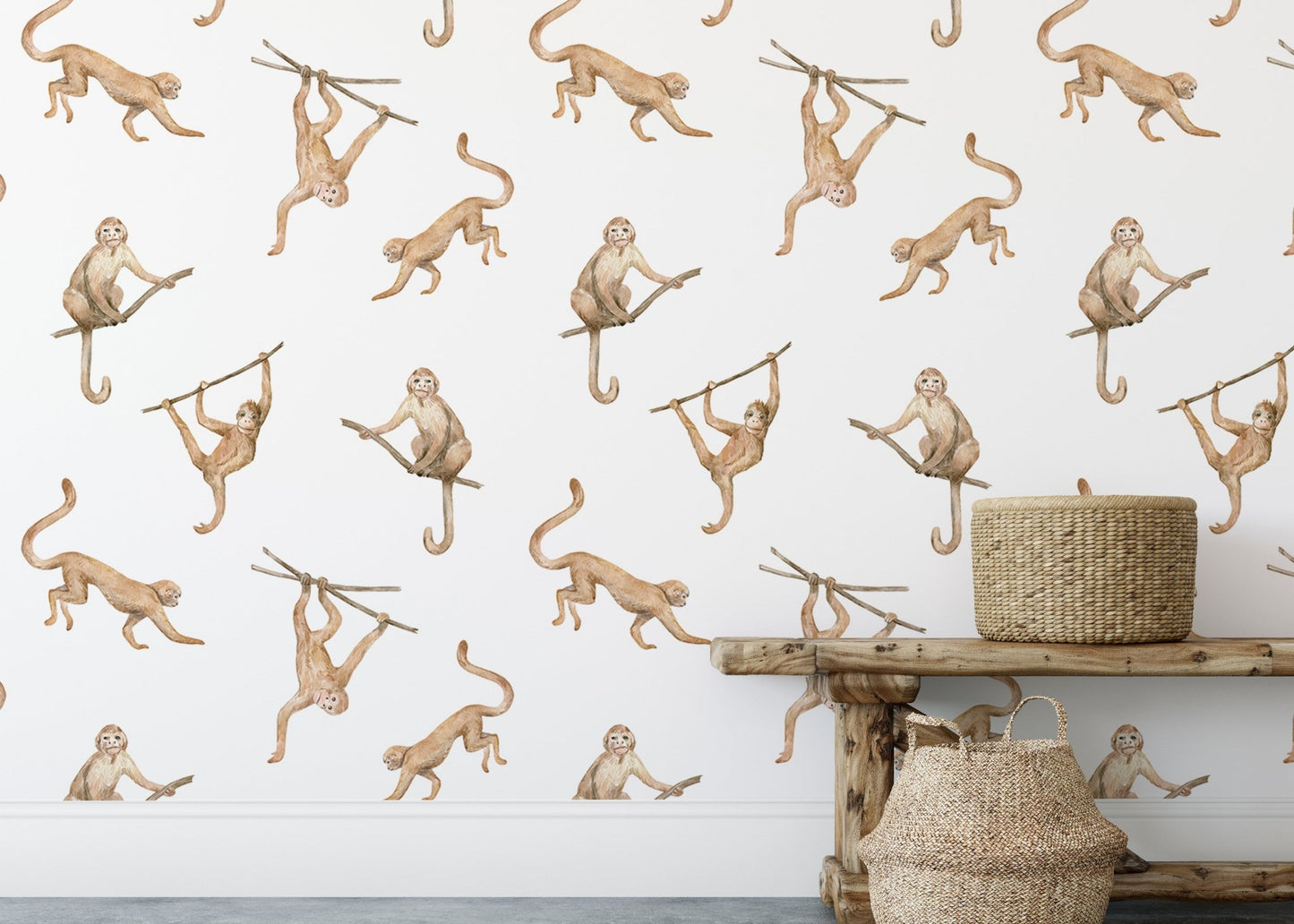 Playful monkey repeat pattern wallpaper behind a wooden bench and baskets.