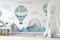 Watercolor mural of nature view with vibrant hot air balloons.

