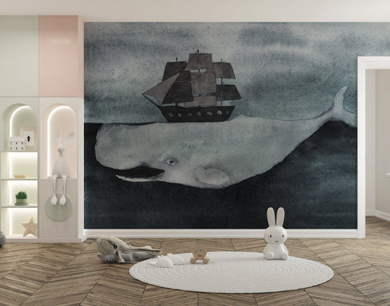 Watercolor ocean whale wall mural with a grey pirate ship in a kids play area.
