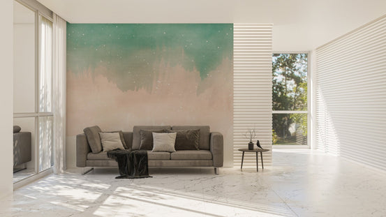Minimalist living area with green and tan ombre wall mural and natural light.