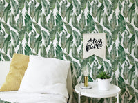 Nature inspired palm wallpaper for a calm bedroom interior.