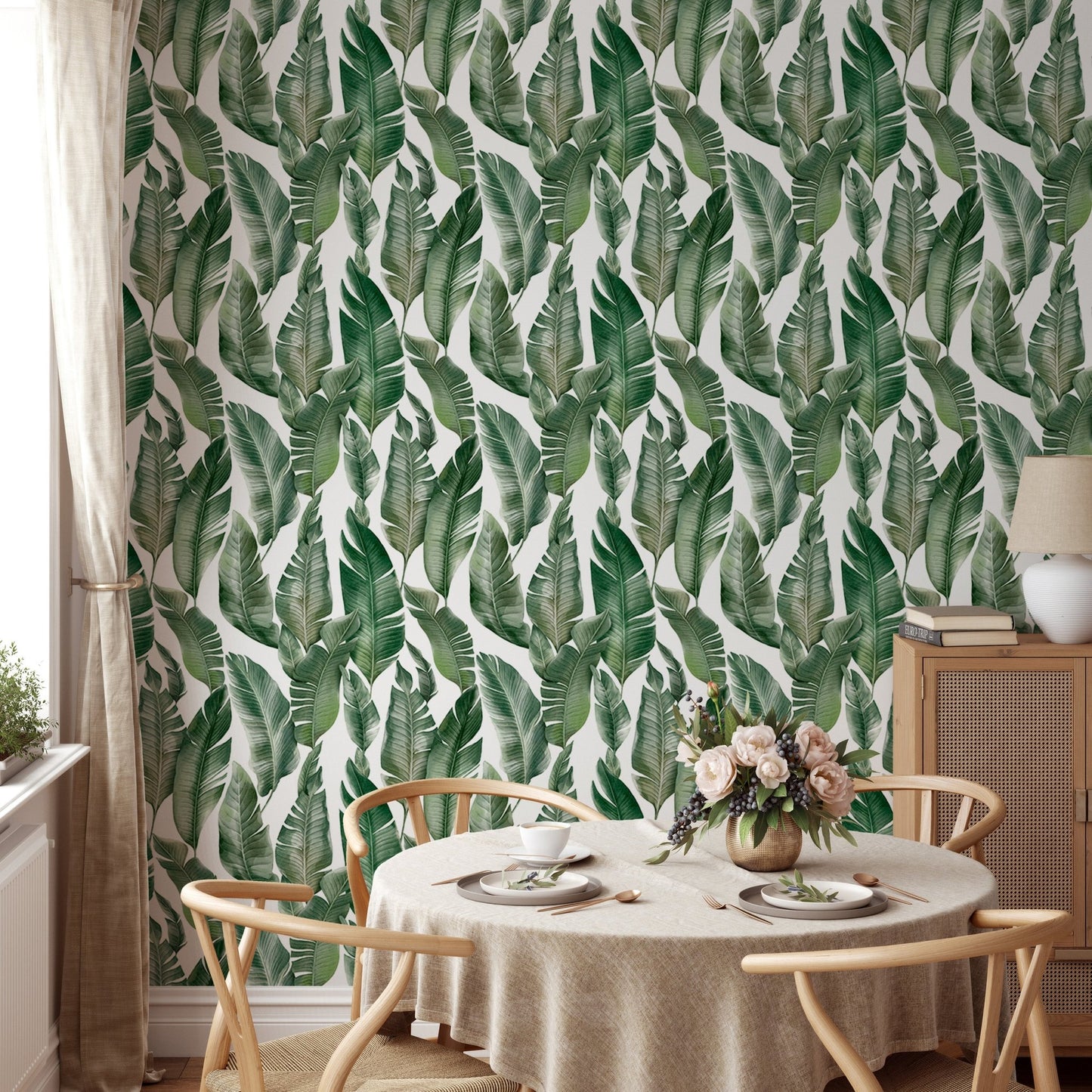Bright dining area with Watercolor Palm Green Leaves wallpaper.