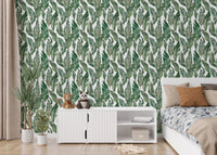 Bedroom interior featuring green palm leaves wallpaper.
