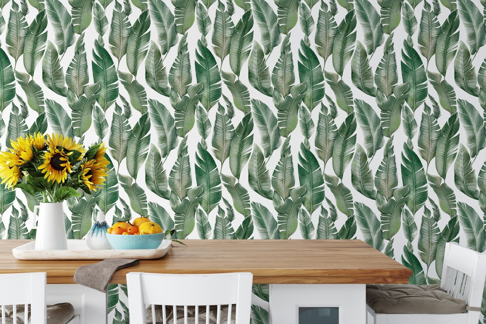 Watercolor Palm Green Leaves wallpaper in a dining room setting.