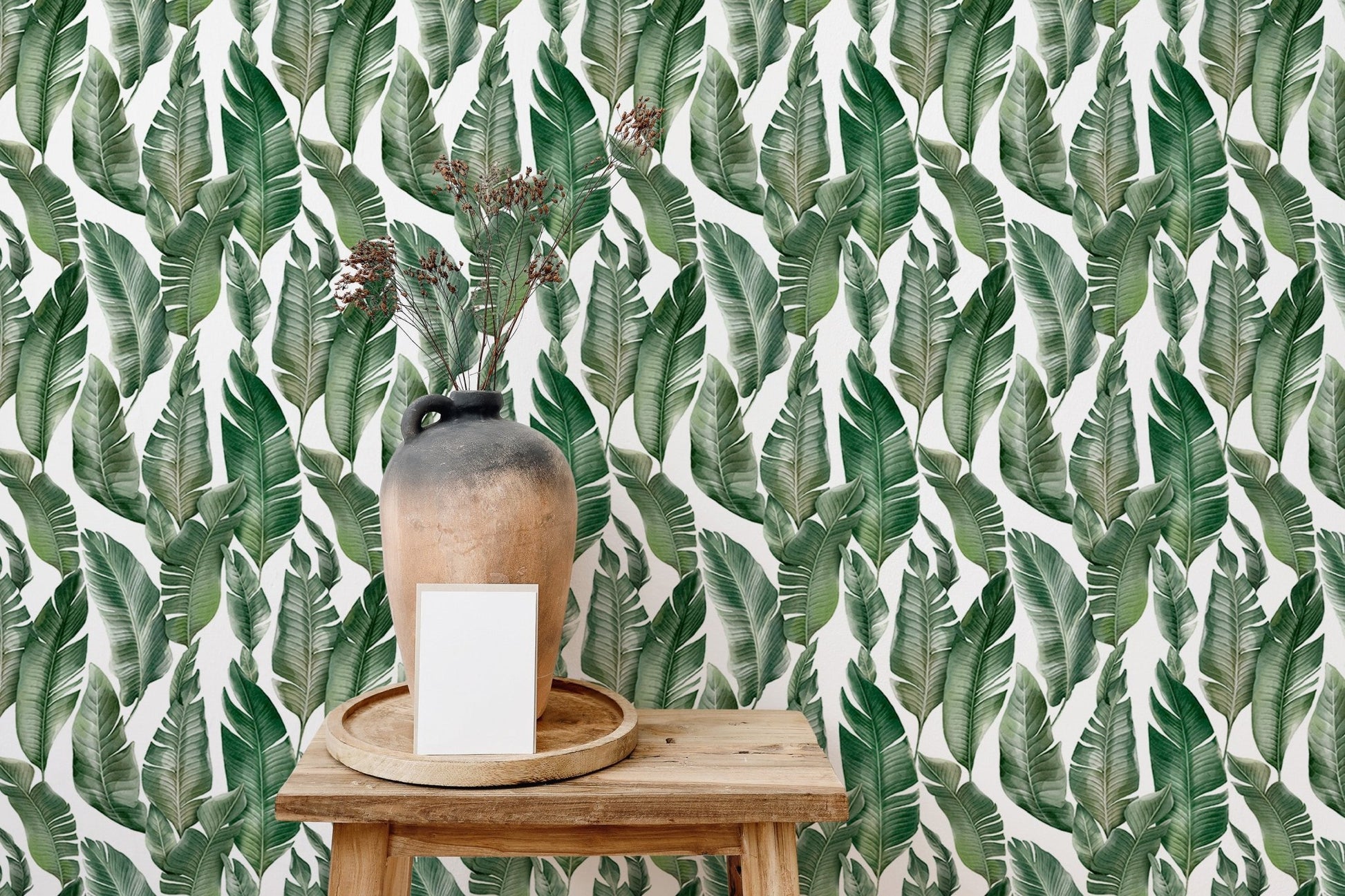 Modern room styled with palm leaves wallpaper.