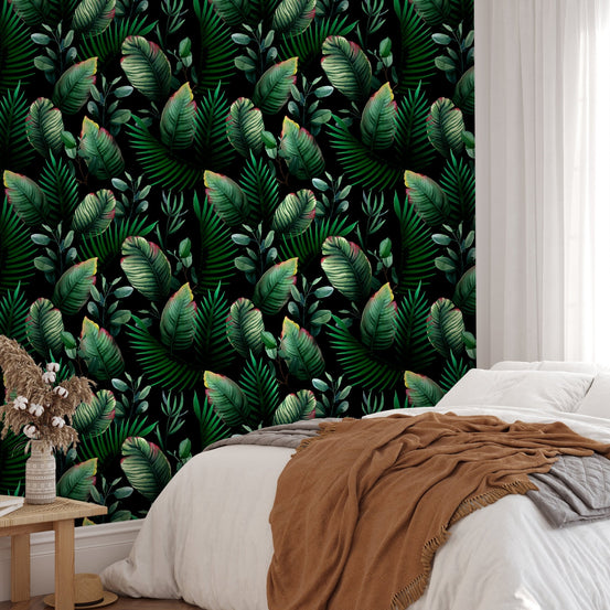 Elegant wallpaper mural showing watercolor palm leaves in a bedroom setting.
