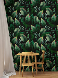 A cozy study area with dark botanical wallpaper mural and wooden furniture.