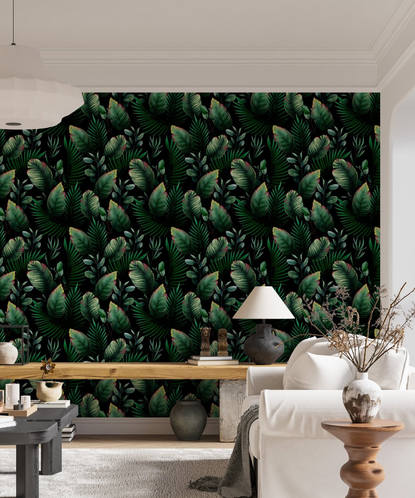 Living room sofa placed against dark green palm leaf pattern wallpaper.
