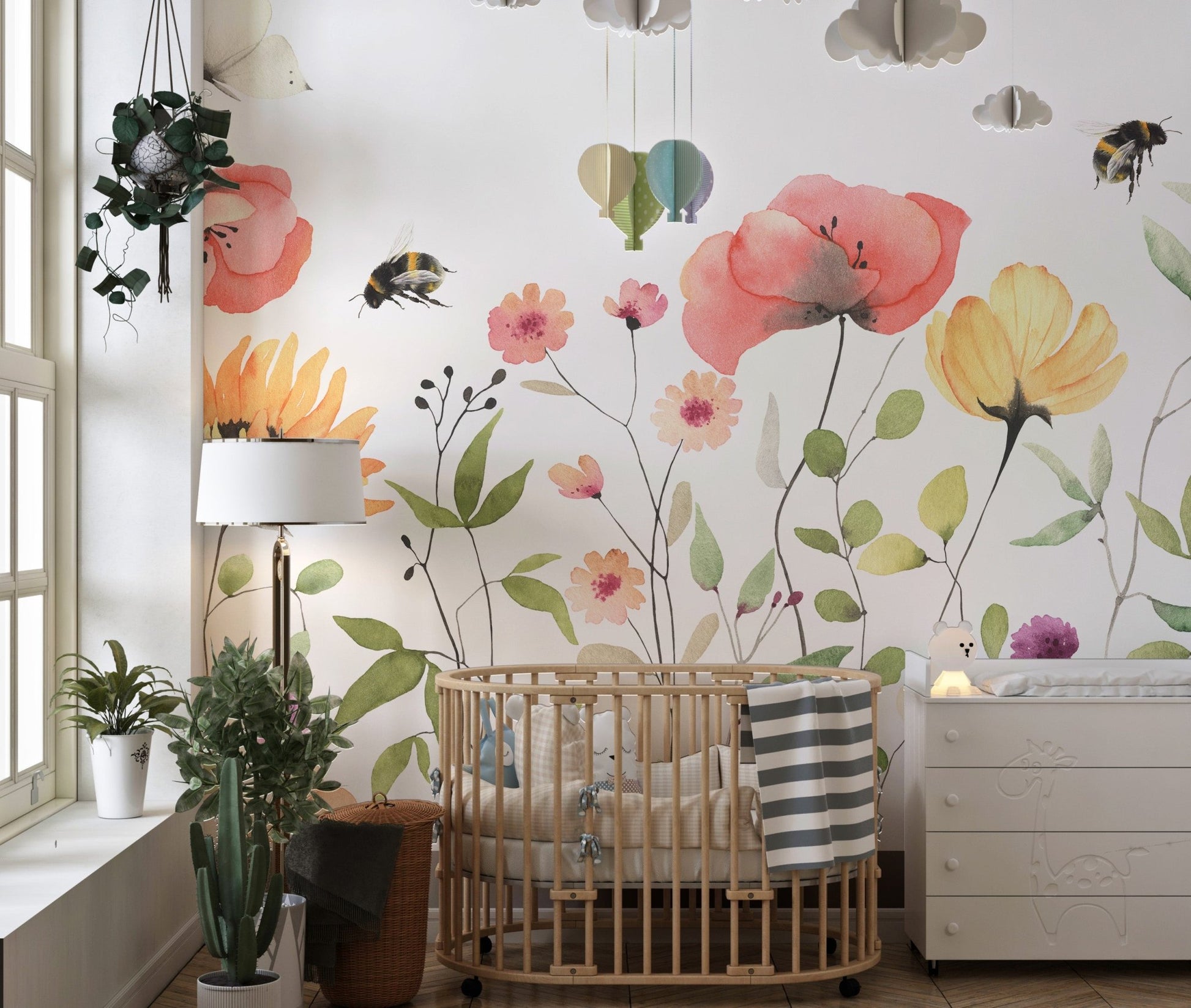 Petal parade wall mural with soft watercolor floral patterns in kids room.
