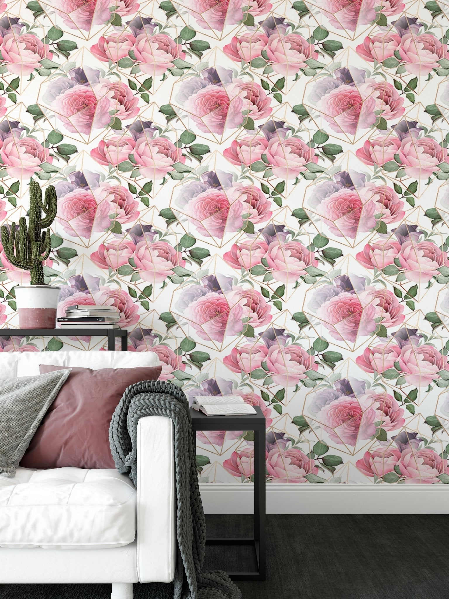 Modern living room wallpaper with pink flowers and a white sofa.