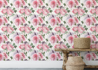 Pink and white watercolor flower wallpaper with woven baskets on a bench.