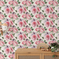 Floral texture wallpaper behind a wooden table with ceramic bowls in kids room.