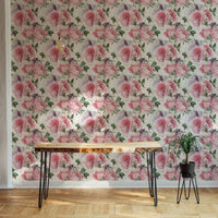 Floral gold line texture wallpaper behind a minimalist wooden desk.