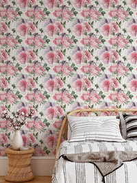Bedroom wallpaper with pink rose patterns and white bedding.