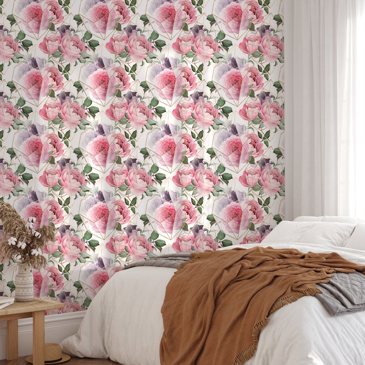Bedroom feature wall with watercolor pink flower wallpaper and brown throw.