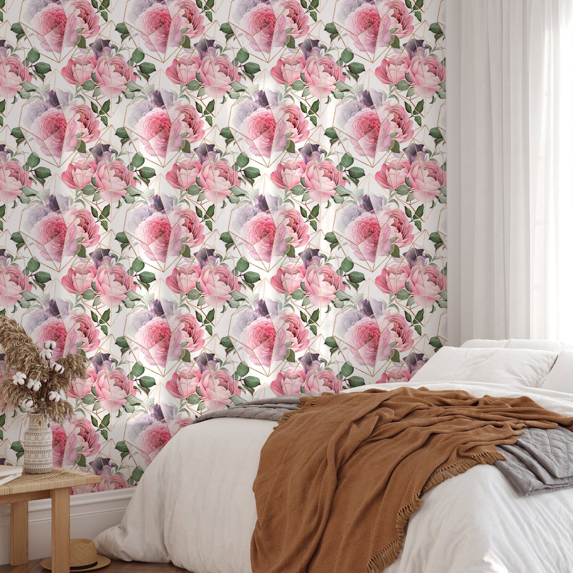 Bedroom feature wall with watercolor pink flower wallpaper and brown throw.