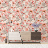 Flower wallpaper behind a contemporary sideboard with a lamp and vase.