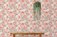 Floral wallpaper featuring pink roses and grey leaves behind a wooden bench.