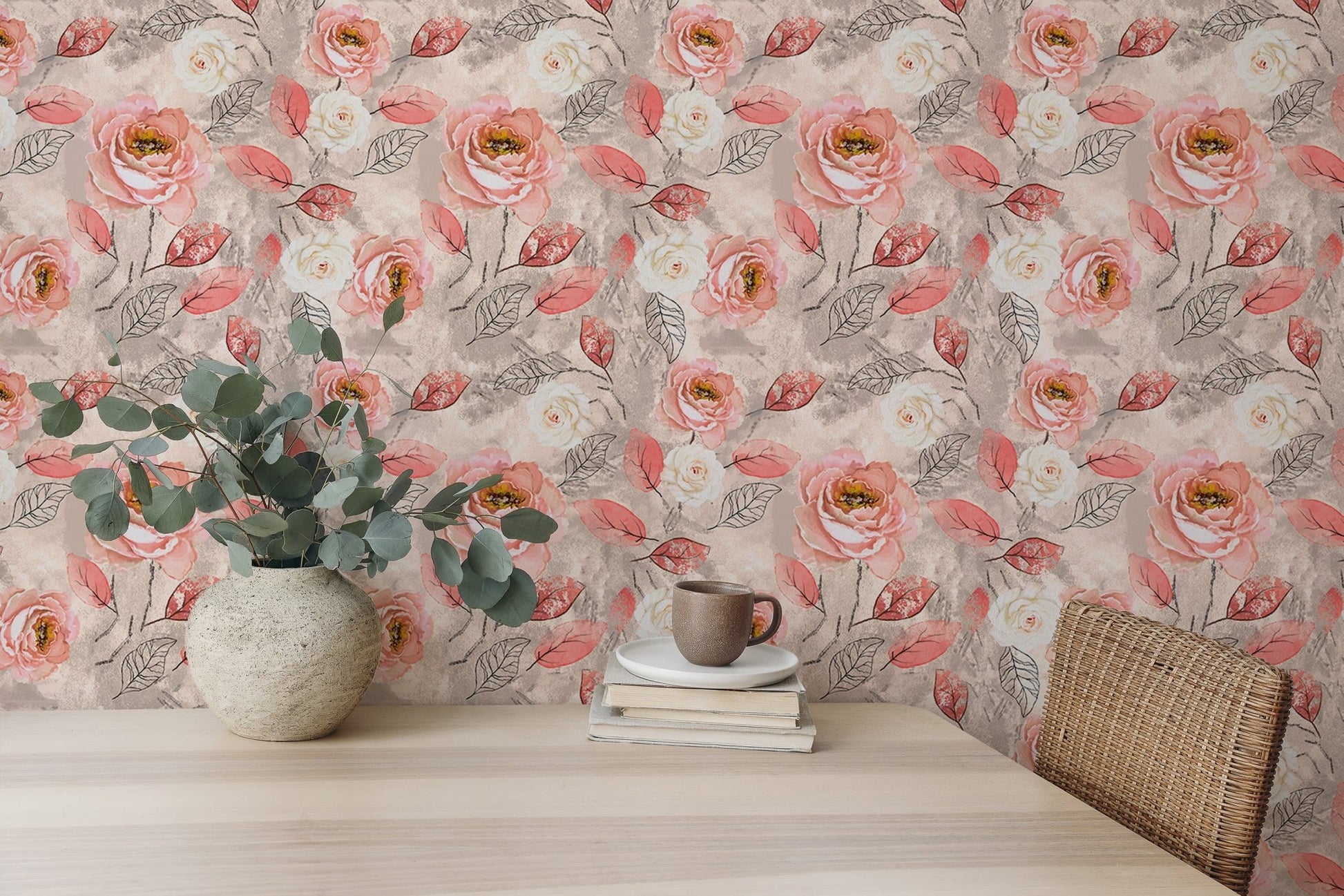 Watercolor flower wallpaper on a study wall with a light wood desk and green plant.