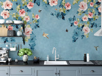 Kitchen backsplash area styled with a blue and green floral wall mural.