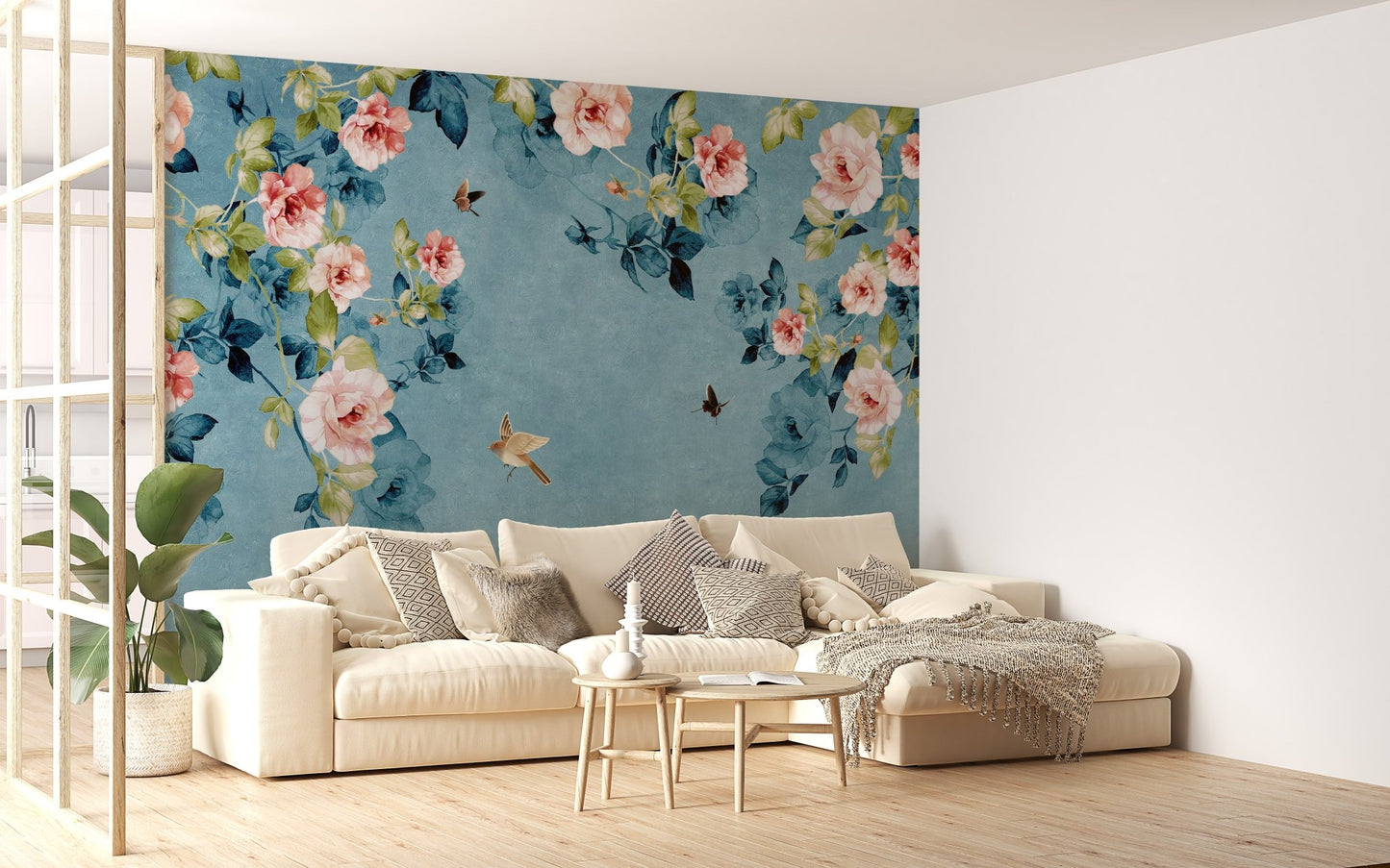Airy living space including a cream sofa and blue botanical wall mural.