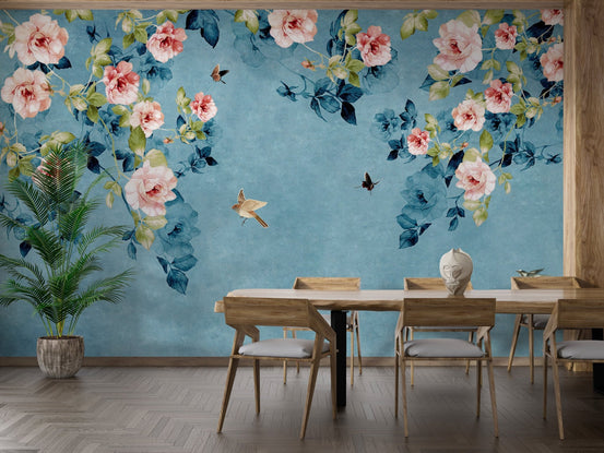 Dining area featuring wooden furniture against a blue floral wall mural.