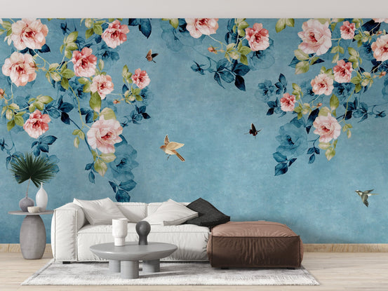 Modern living space with a white couch and teal roses wall mural.