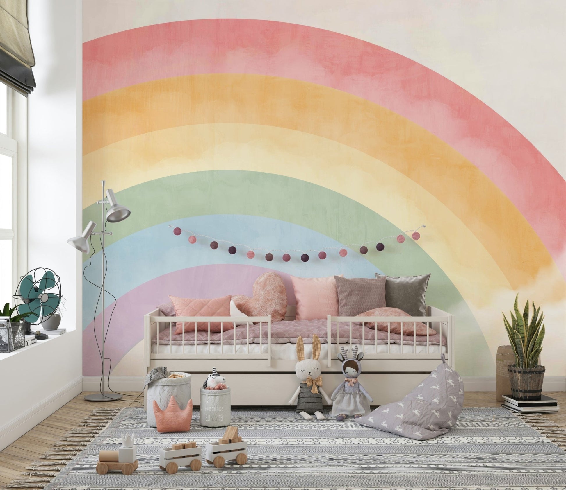 Nursery wall decor featuring soft rainbow arch and cloud details.